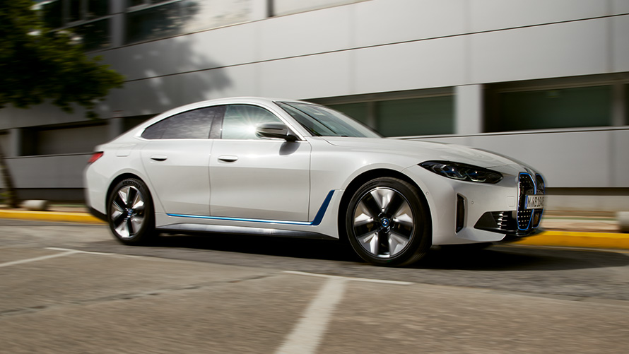 BMW i4 G26 2021 side view in front of building BMW i4 G26 2021 side view in front of building