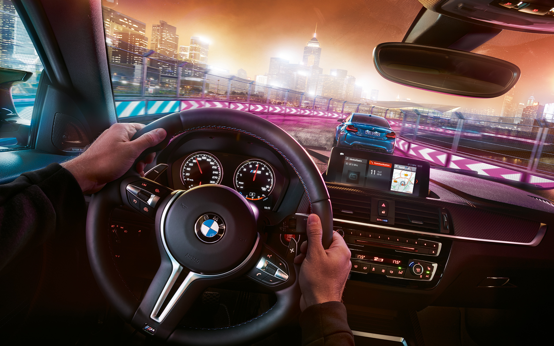 BMW M2 Competition cockpit Two BMW M2 Competition in racing situation at night, view from cockpit