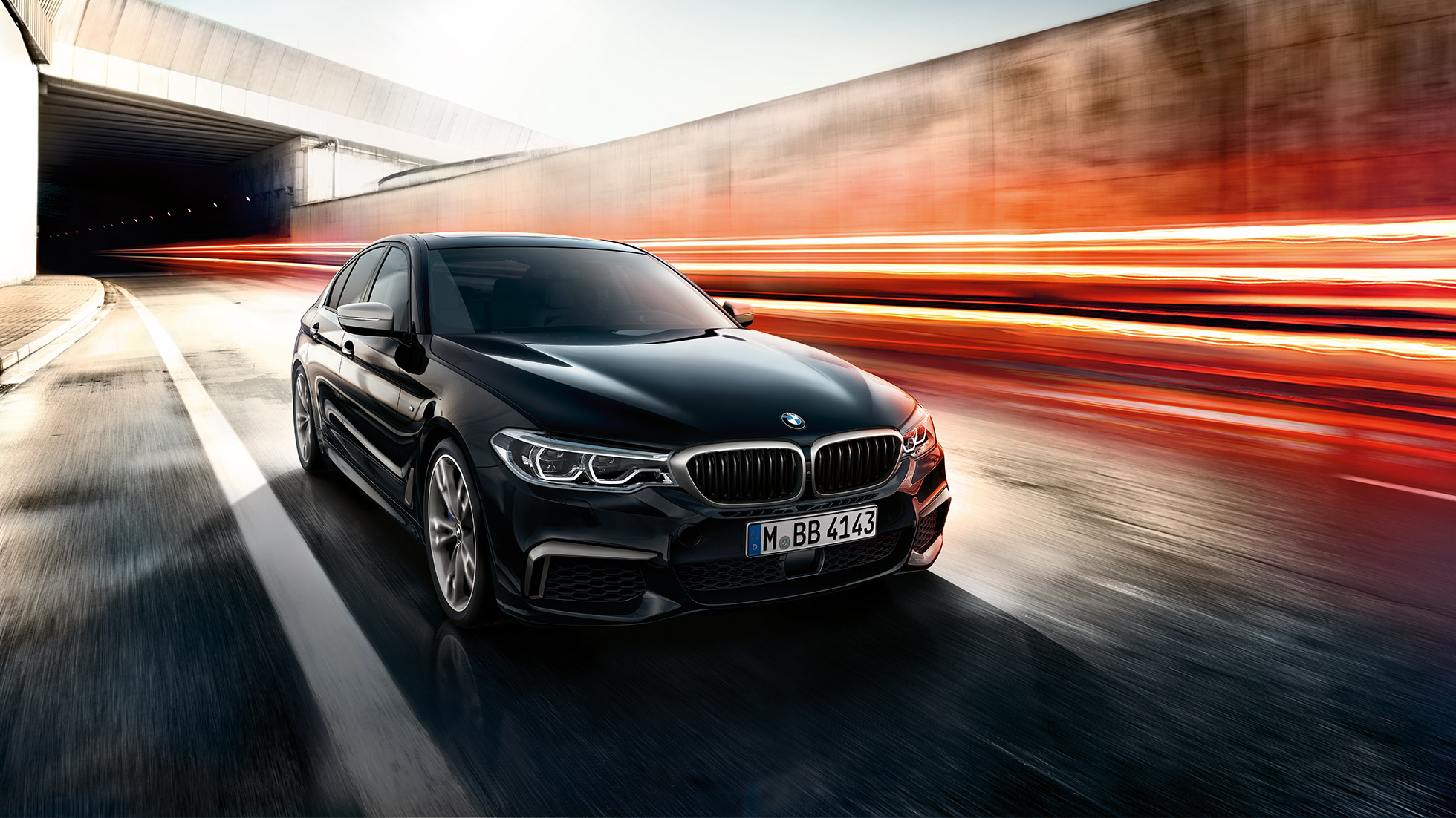 BMW M550i and BMW M550d. BMW M550i and BMW M550d three-quarter front shot while driving.