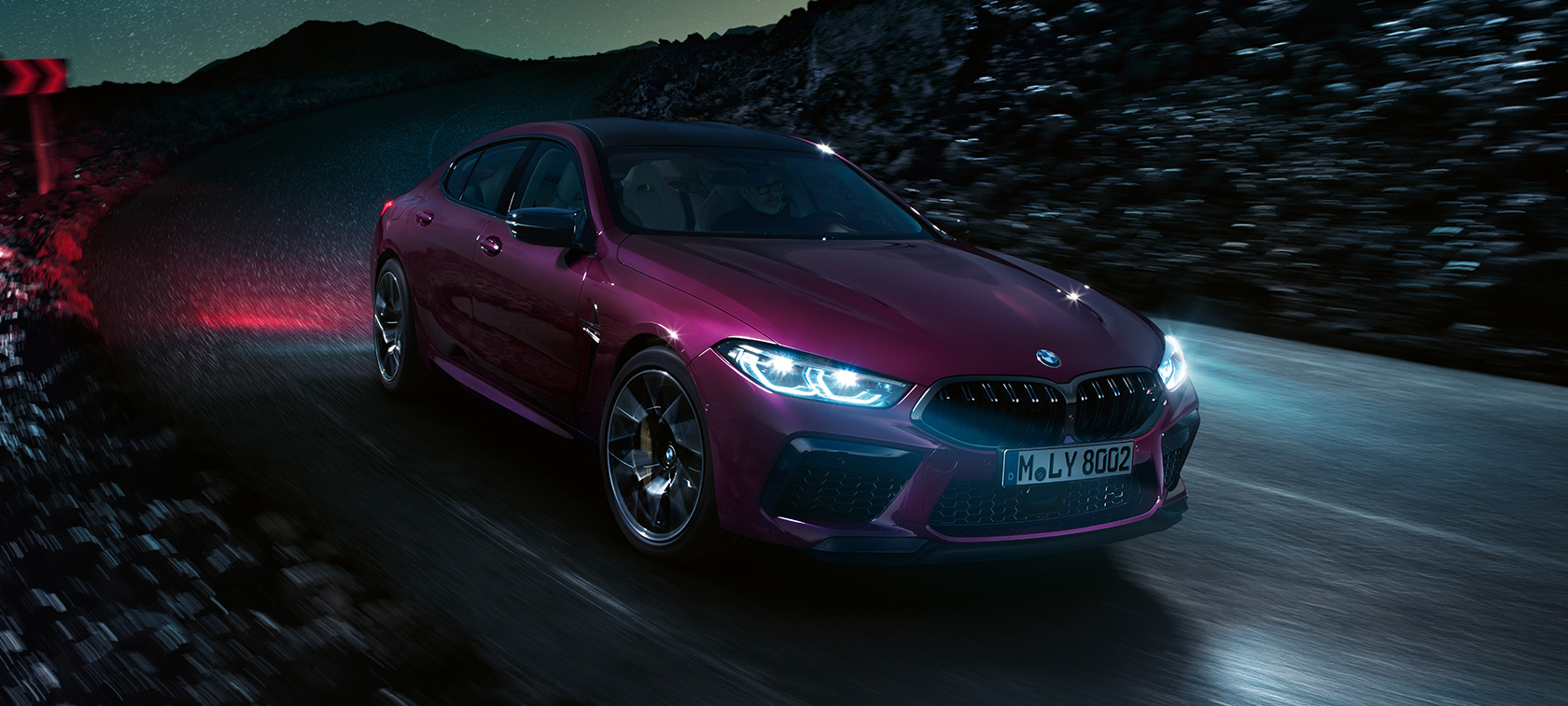 BMW M8 Competition Gran Coupé three-quarter front view BMW M8 Competition Gran Coupé F93 2020 BMW Individual Ametrine metallic driving at night three-quarter front view