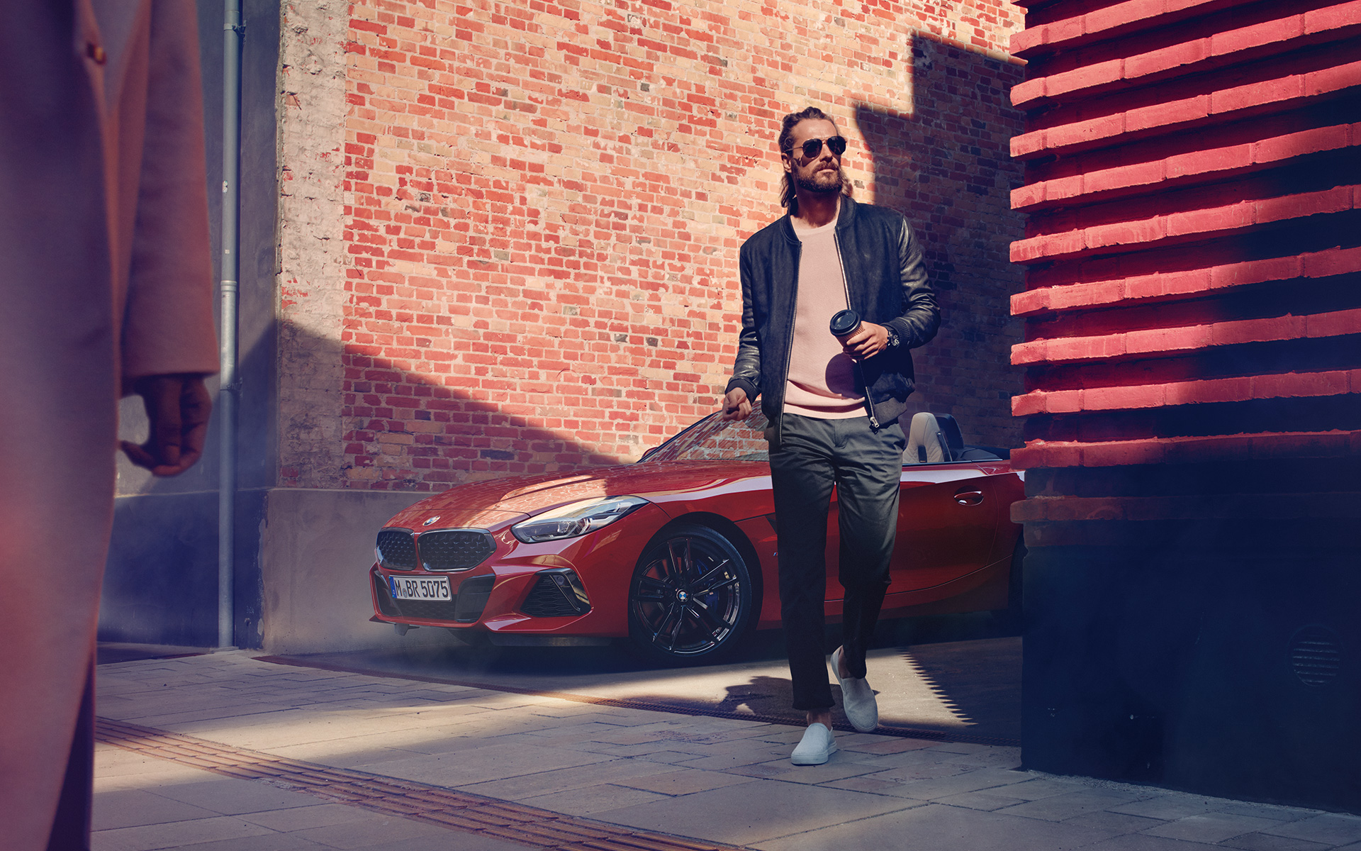 BMW Z4 Roadster (G29) in side street Man in a side street in front of BMW Z4 Roadster (G29)