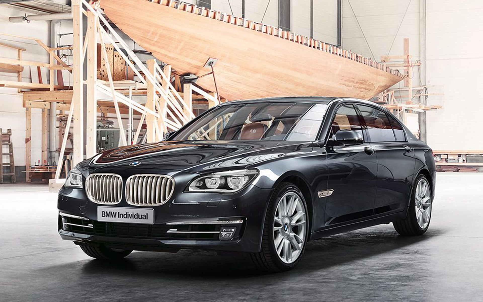 BMW Individual 760Li Sterling inspired by ROBBE & BERKING F01 2013 in front of sailing yacht in shipyard hall BMW Individual 760Li Sterling inspired by ROBBE & BERKING F01 2013 three-quarter front view in front of sailing yacht in shipyard hall
