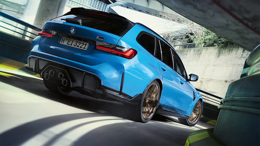 BMW M3 Touring G81 BMW M Performance Parts three-quarter rear view driving
