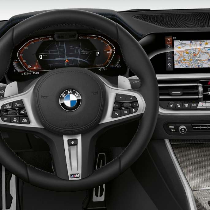 Frontal close-up of the driver's cockpit of the BMW 3 Series Sedan with Model Sport Line features.