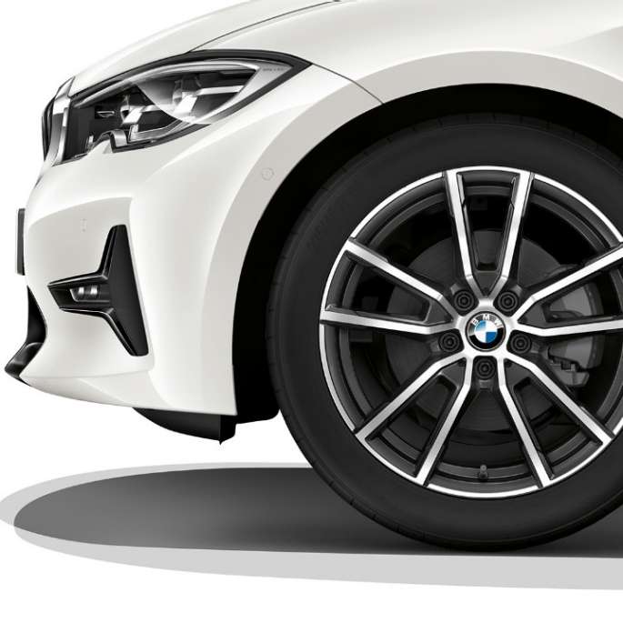 Close-up of the light alloy wheel of the BMW 3 Series Sedan with Model Sport Line equipment.
