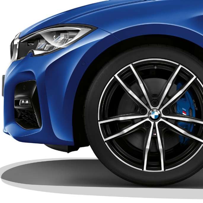 Close-up of the light alloy wheel of the BMW 3 Series Sedan with Model M Sport equipment.