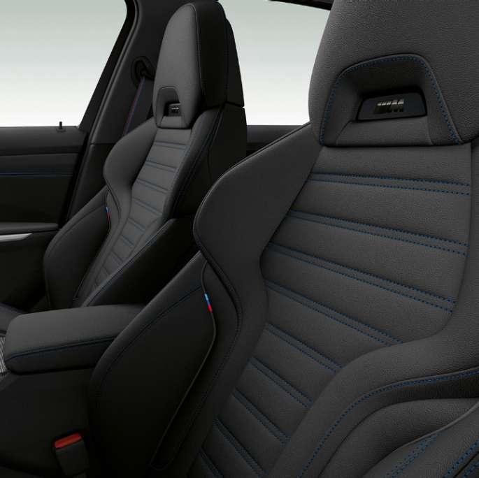 Side close-up of the front seats of the BMW 3 Series Sedan with Model M Sport features.